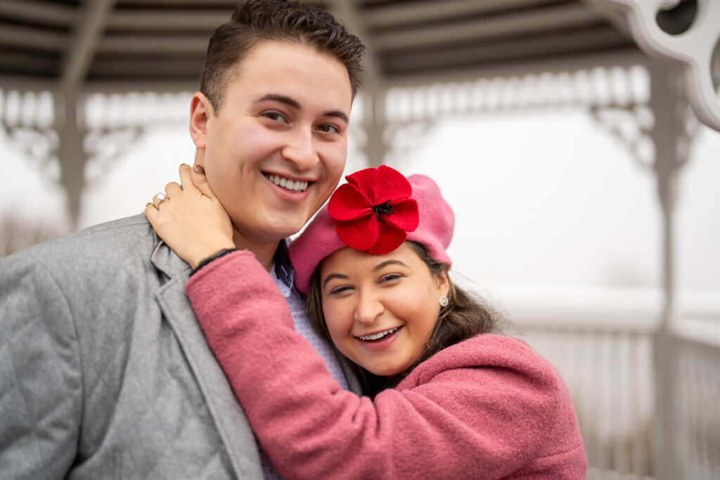 Close-up portrait of smiling newly engaged couple at The Views at Mount Fuji venue.