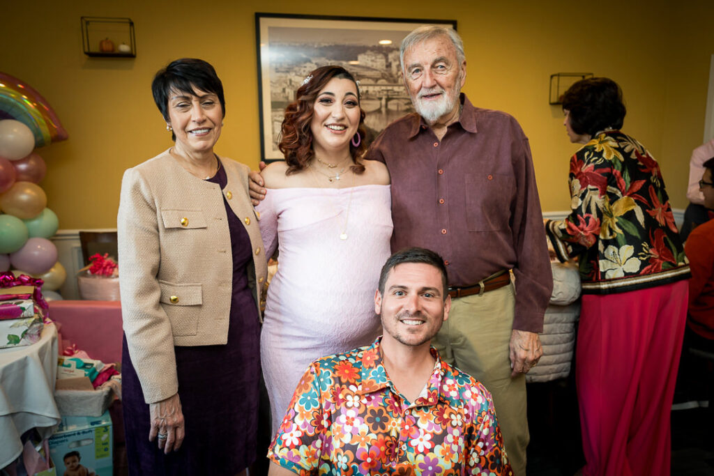 Extended family group photo at groovy baby shower celebration Delpino Restaurant New Jersey