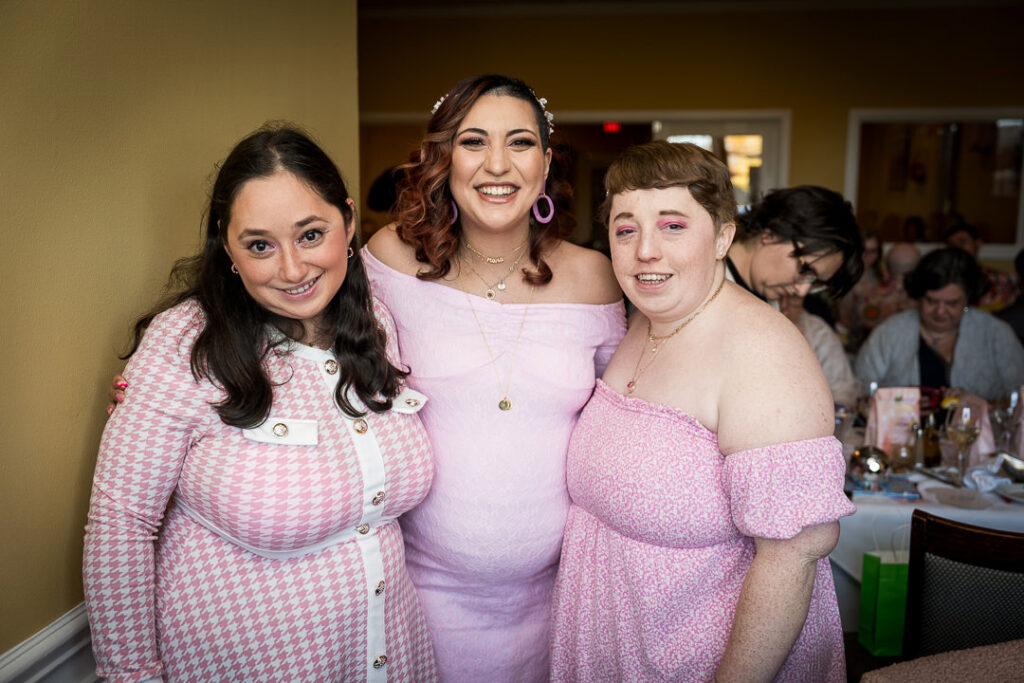 Family and friends group portrait at groovy themed baby shower Delpino Restaurant NJ