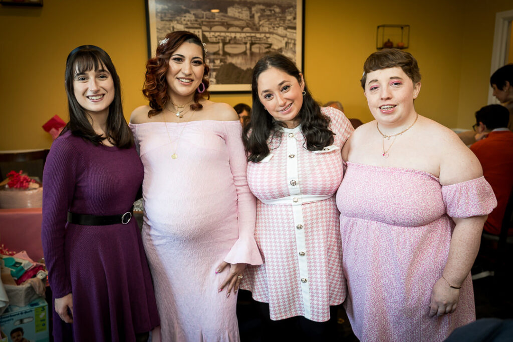 Friends group portrait in coordinating dresses at groovy themed baby shower New Jersey