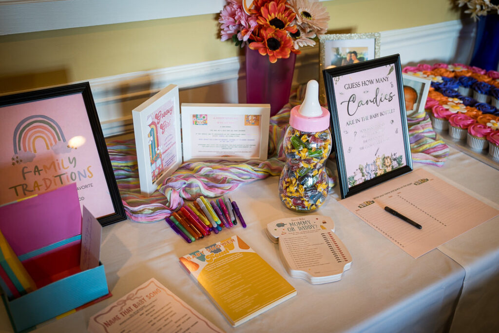 Retro 70s baby shower invitation with rainbow arch and VW bus at Delpino