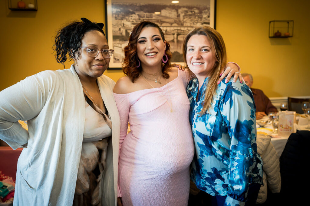 Expecting mom with two close friends at groovy baby shower celebration Delpino Restaurant