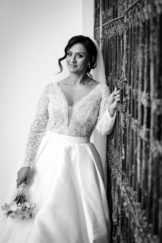 Black and white artistic bridal portrait on staircase at James Ward Mansion Westfield by Alex Kaplan