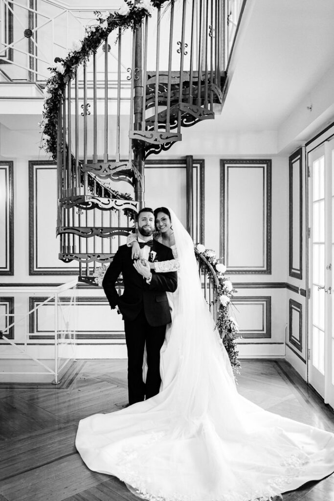 Black and white romantic wedding portrait on spiral staircase James Ward Mansion by Alex Kaplan Photograph