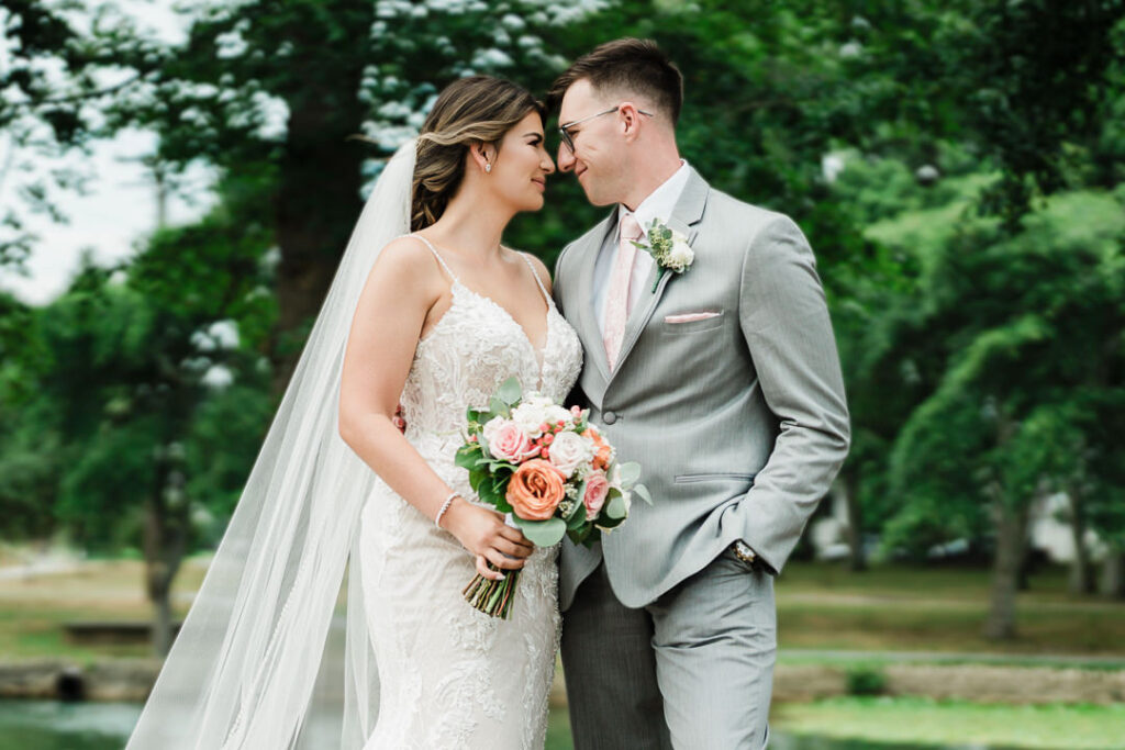 Bride and groom sharing romantic moment outdoors at sunset by New Jersey photographer Alex Kaplan