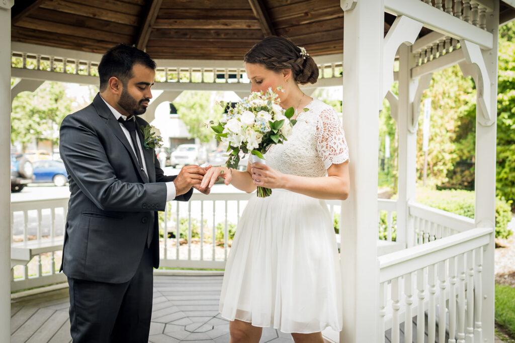 Natural light portrait in Bergen County courthouse covered walkway by Alex Kaplan wedding photographer