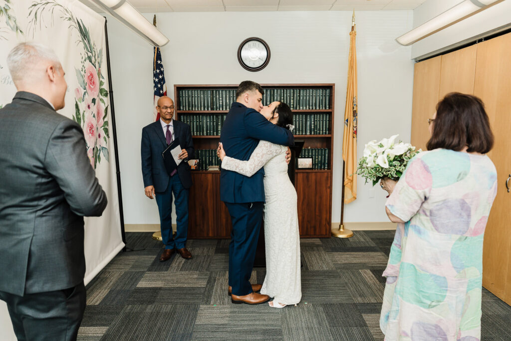 Young daughter as flower girl at Bergen County courthouse wedding photographed by Alex Kaplan