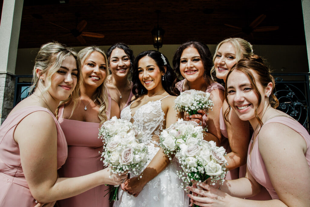 Bride with seven bridesmaids in blush dresses The Grand Totowa outdoor ceremony