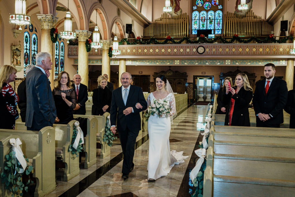 Bride and father walking down aisle at St. Hedwig Church by Alex Kaplan Photography
