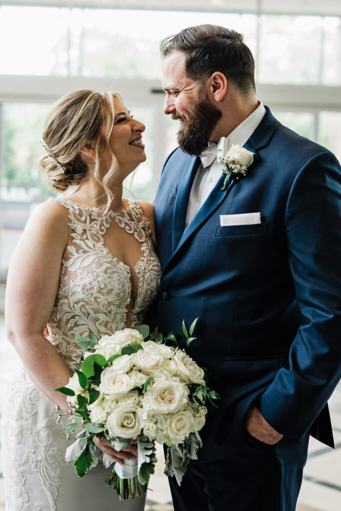 Bride Lindsay and groom John sharing intimate first look moment at Berlin Park NJ before Lucien's Manor wedding by Alex Kaplan Photography