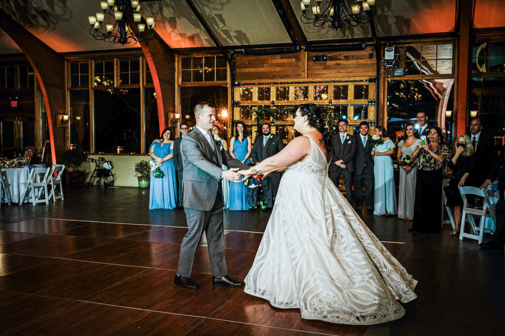 First dance at The Conservatory at Sussex County Fairgrounds winter wedding with dramatic lighting by Alex Kaplan Photography