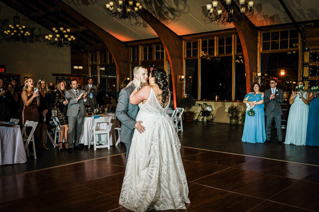 Romantic first dance moment with bridal party watching at Conservatory Sussex County Fairgrounds wedding by Alex Kaplan