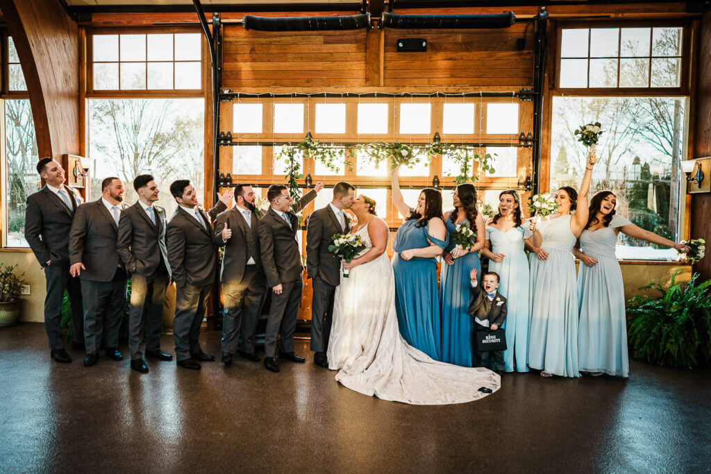 Wedding party playful photo with bride and groom at The Conservatory Sussex County Fairgrounds by Alex Kaplan Photography