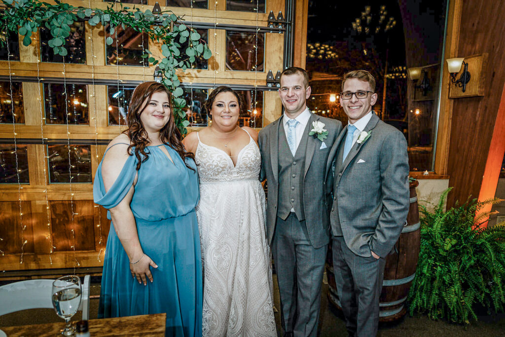 Newlyweds with maid of honor and best man during reception at The Conservatory Sussex County Fairgrounds by Alex Kaplan Photography