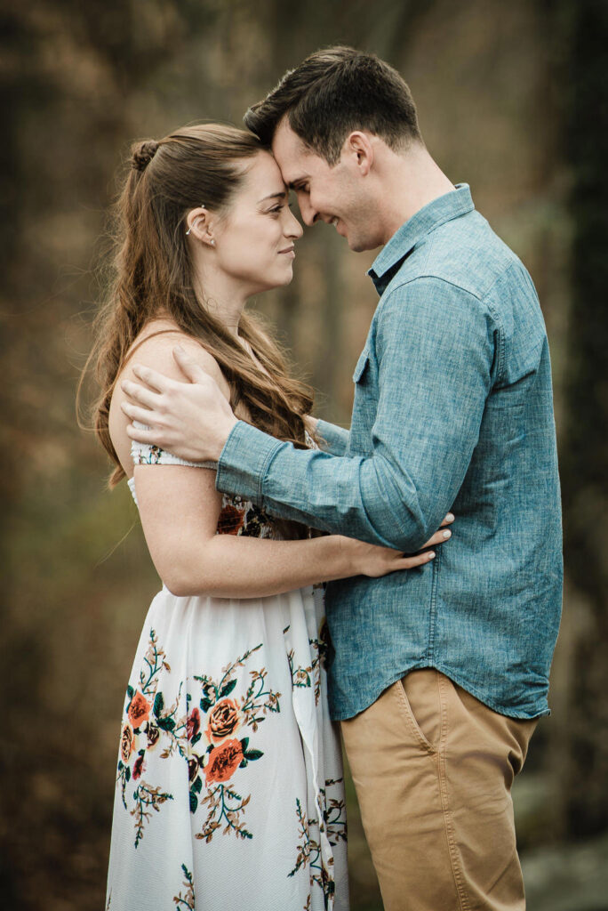 Engaged couple touches foreheads in intimate moment during Sayen Gardens engagement photos in Hamilton NJ