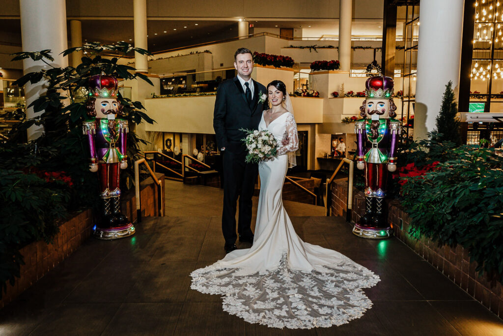 Couple with nutcracker Christmas decorations in Princeton by Alex Kaplan Photography