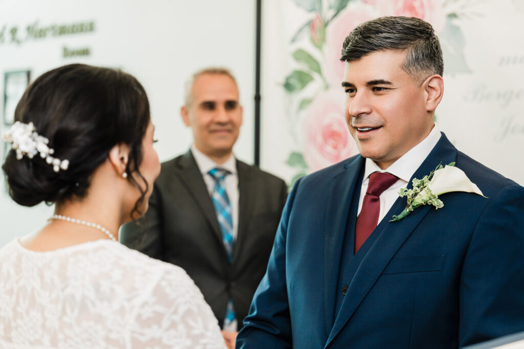 Newlyweds first kiss at Bergen County courthouse wedding ceremony photographed by Alex Kaplan