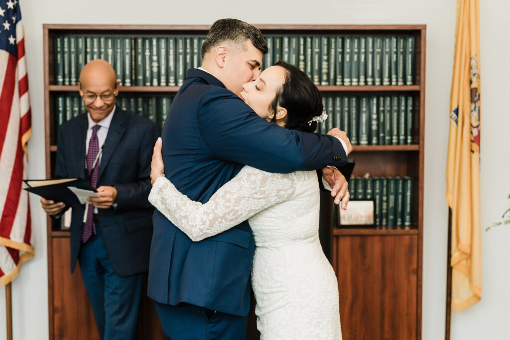 Family of three celebrating wedding day at Bergen County courthouse by photographer Alex Kaplan