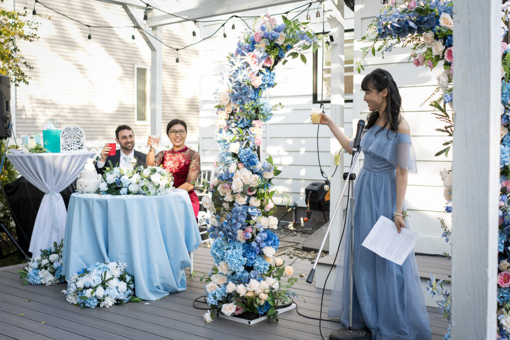 Bridesmaid gives speech at Fair Lawn backyard reception