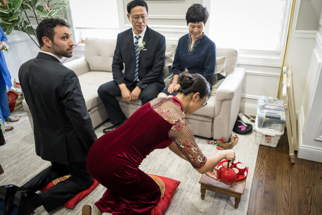 Bride in traditional red qipao for Fair Lawn tea ceremony