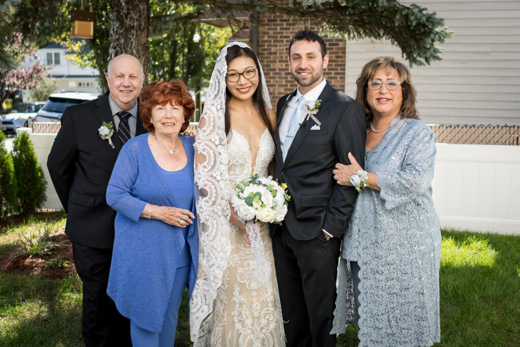 Groom's family portrait at Fair Lawn home wedding