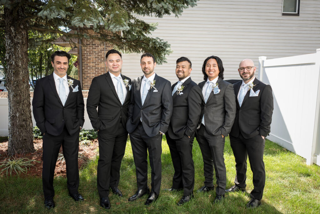 Groomsmen in charcoal suits at Fair Lawn home wedding