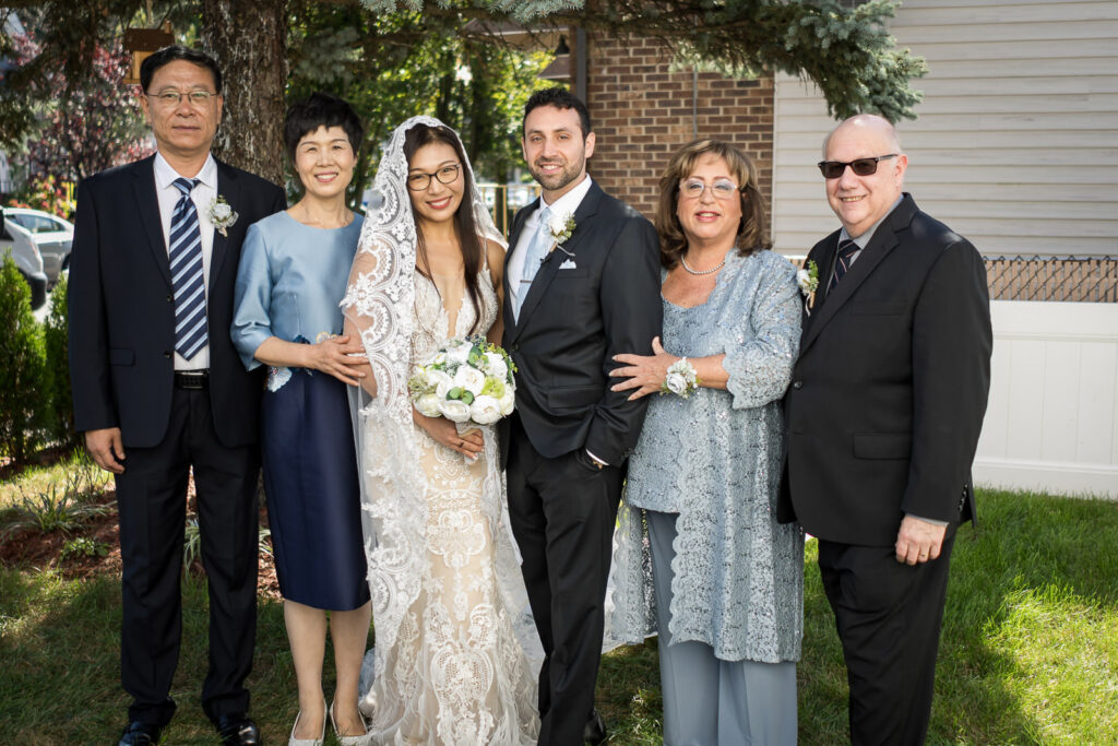 Both families celebrate together at Fair Lawn multicultural wedding