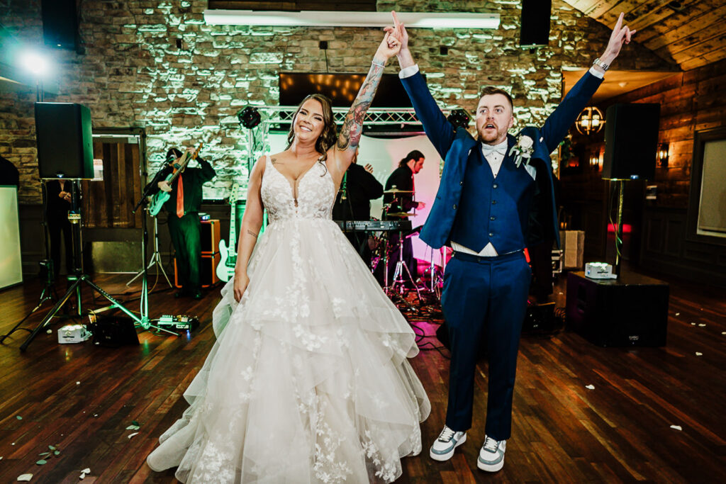 Bride and groom grand entrance at 618 Restaurant wedding reception Freehold Township NJ photographed by Alex Kaplan