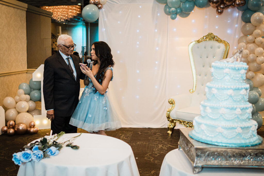 Grandfather with birthday girl at cake table The Elan Lodi NJ Sweet Sixteen