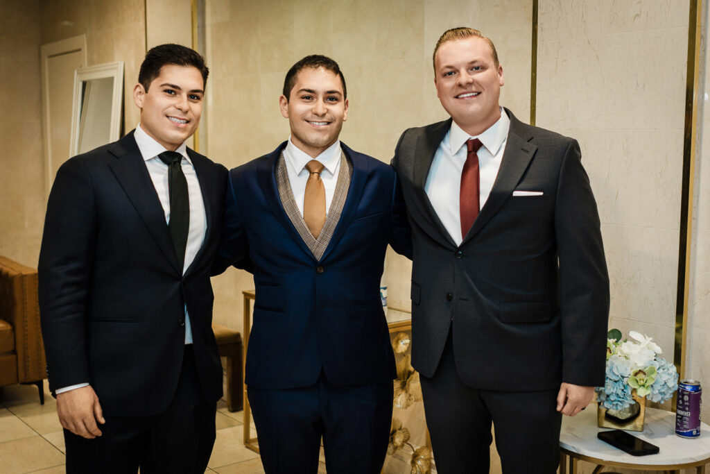 Groom with groomsmen indoor portraits at Riverview Ballroom Cliffside Park NJ Orthodox Jewish wedding
