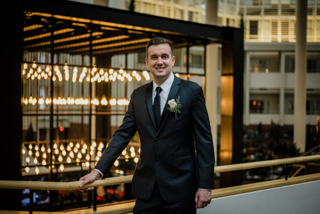 Groom portrait in Hyatt Regency Princeton atrium by Alex Kaplan