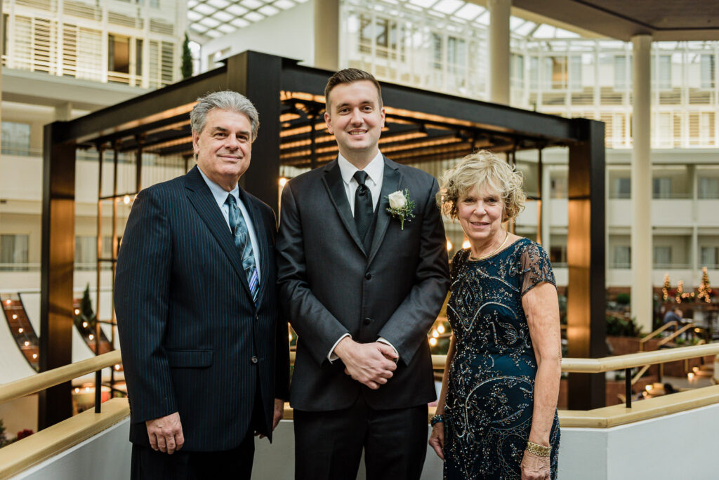 Groom with parents at Hyatt Regency Princeton wedding by Alex Kaplan