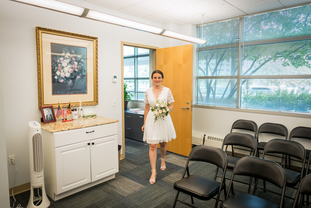 Bride in short white lace dress at Hackensack courthouse ceremony photographed by Alex Kaplan