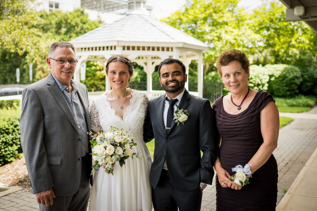 Family portrait with bride's parents at Hackensack courthouse by Alex Kaplan photographer
