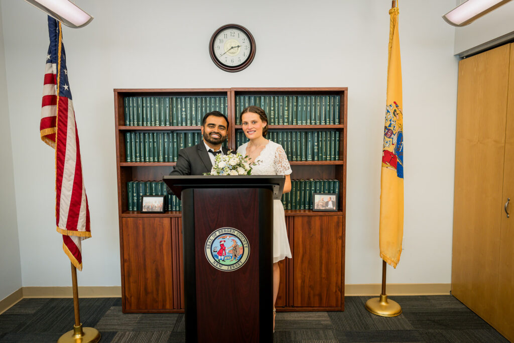 Architectural framing of couple in Hackensack courthouse gazebo by Alex Kaplan Photography