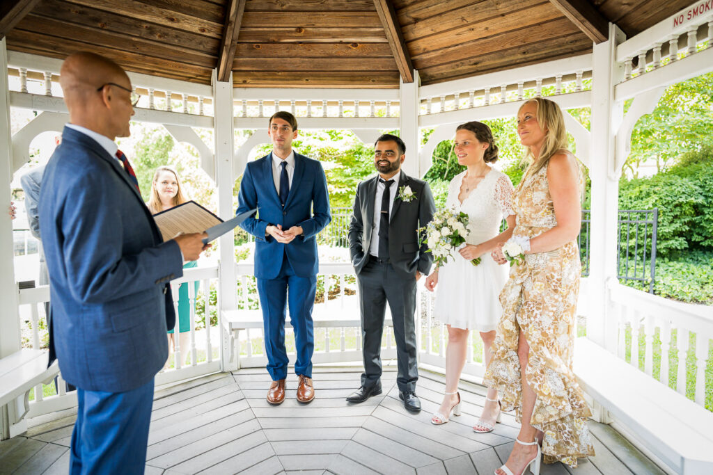 Hackensack courthouse wedding ceremony with officiant at outdoor gazebo by Alex Kaplan