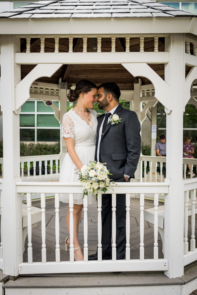 Newlyweds walking away together after Hackensack courthouse ceremony by Alex Kaplan Photography