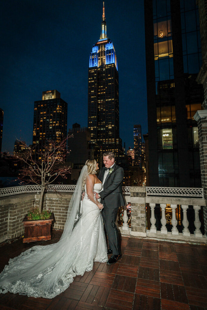 Rooftop wedding portrait with Empire State Building at Midtown Loft & Terrace