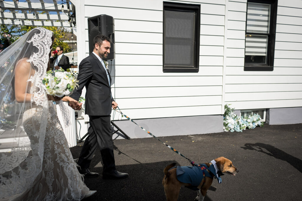 Couple walks down aisle with dog after NJ home wedding ceremony