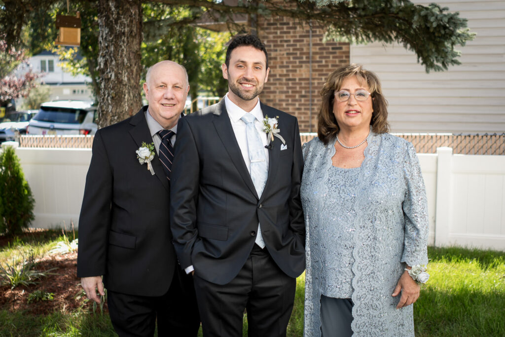 Groom with parents at Northern NJ backyard wedding