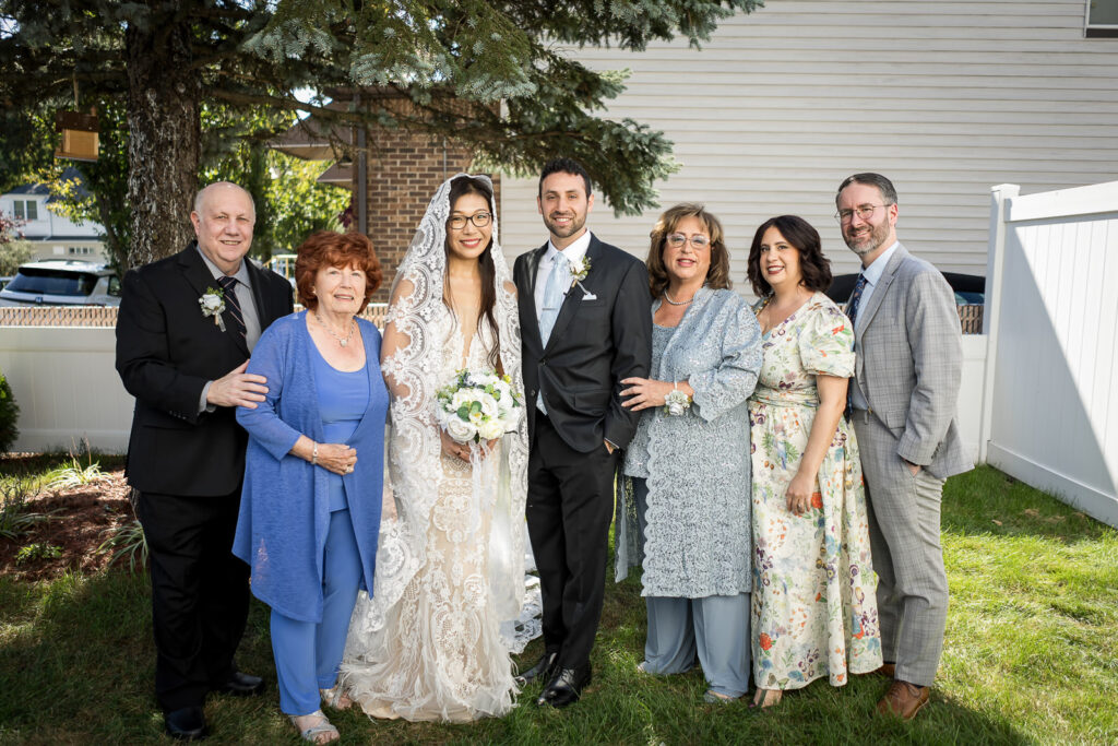 Groom's multigenerational family at Northern NJ home wedding