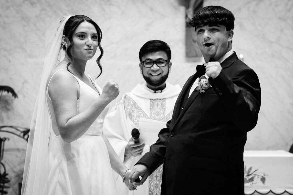 Bride and groom exchanging vows during Catholic ceremony at Notre Dame of Mt Carmel Cedar Knolls