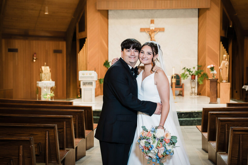Bride and groom intimate portrait at Notre Dame of Mt Carmel altar by Alex Kaplan Photography