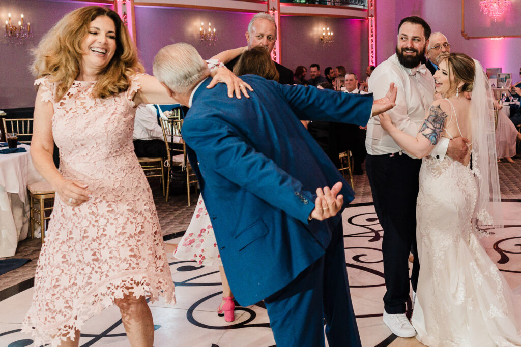 Parents dancing together during reception at Lucien's Manor Versailles ballroom photographed by Alex Kaplan