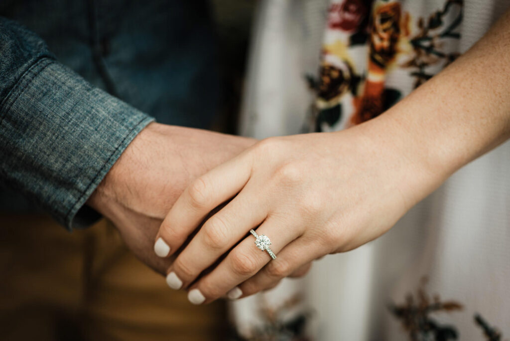 Three-stone diamond engagement ring detail photo at Sayen Gardens New Jersey engagement photography session