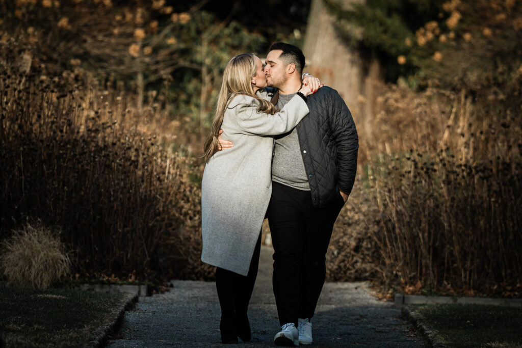 Engaged couple kissing at Van Vleck House and Gardens engagement session in Montclair Essex County NJ