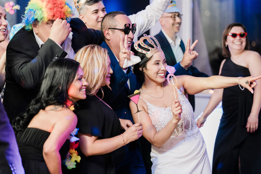 Bride wearing photo booth crown at Waterside wedding reception photographed by Alex Kaplan