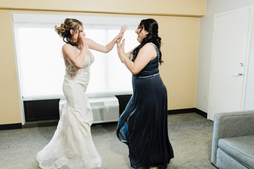 Bridesmaids celebrating with bride before ceremony Windsor Ballroom New Jersey