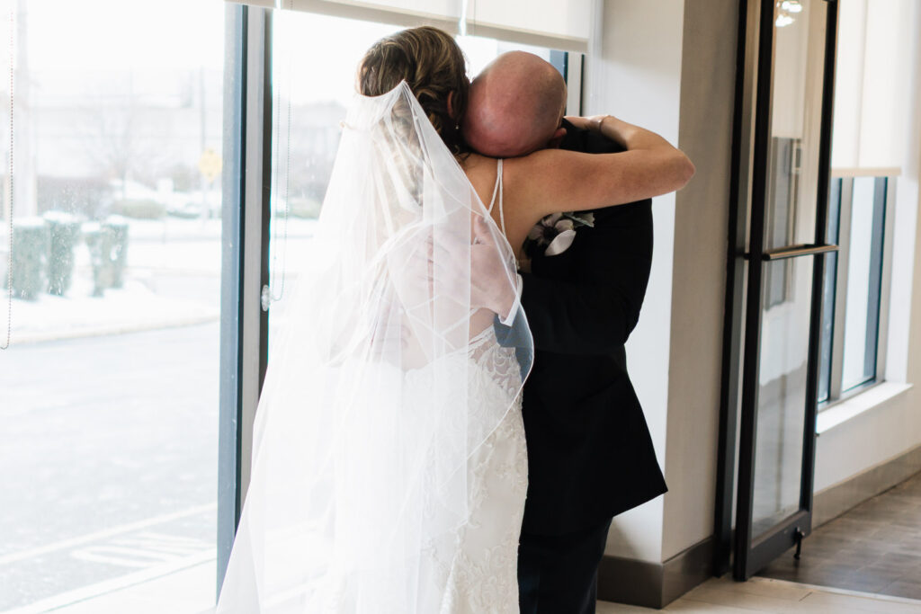 Emotional father daughter hug before ceremony Windsor Ballroom East Windsor