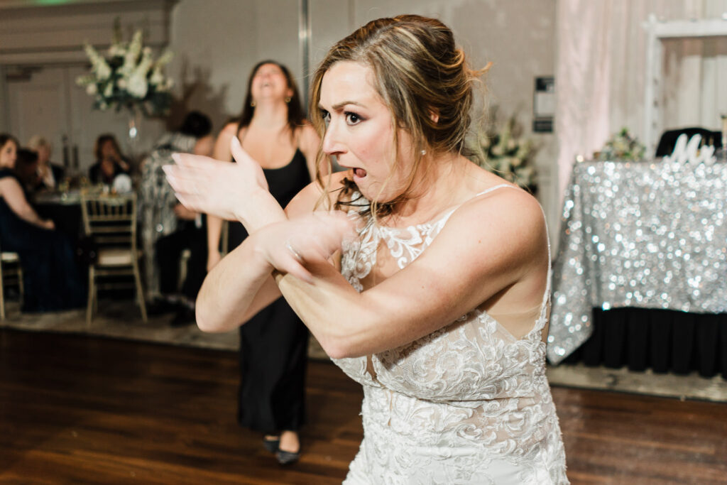 Bride dancing during hora celebration Windsor Ballroom Jewish wedding traditions